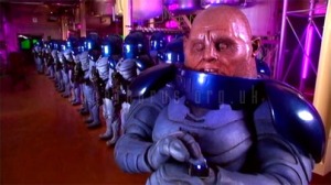 Commander Skorr presumably takes his helmet off so that the other Sontarans know who he is.